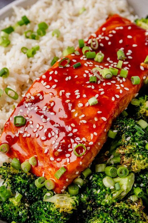 This honey sriracha salmon has tender flaky texture in every bite and offers the perfect balance of sweet and spicy flavors. Its bright, shiny glaze looks as rich and bold as it tastes. Serve it over white rice and veggies for a complete meal. Honey Sriracha Salmon, Sriracha Salmon, Honey Sriracha Sauce, Rice And Veggies, Salmon Rice Bowl, Healthy Baking Recipes, Baked Salmon, White Rice, Sriracha