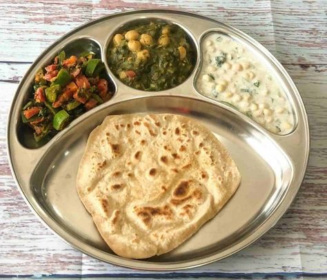 What my lunch looks like today. A portion of Sarson Chole served along with Gajar Simla Mirch sabzi and some  Raita along with a hand made… Boondi Raita Recipe, Seekh Kebab Recipes, Boondi Raita, Saag Recipe, Meal Plate, Healthy Bowls Recipes, Fried Fish Recipes, Paratha Recipes, Kebab Recipes