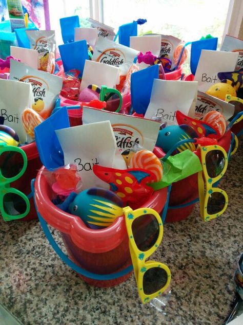 Take home containers for Nemo Birthday party. Fish squirters, jellybeans in a fish wrapper, Nemo swirl lollipop, fish ring lollipop, kiddie sunglasses, goldfish crackers, shovel, fun fishy straw  gummy worms in "bait" baggies, all put in a pail Fishing Goodie Bag Ideas, Finding Nemo Party Favors, Finding Nemo Birthday Party Ideas, Fishing Party Favors, Goldfish Party, Finding Dory Birthday Party, Dory Birthday Party, Finding Dory Party, Boyfriends Birthday Ideas