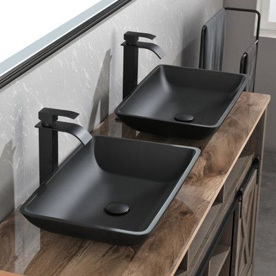 This unique sink is not only a work of art but also functional with its scratch-resistant, tempered glass construction for added durability. The sink works with a variety of bases, so you can create a customized design to fit your bathroom. Lordear Sink Finish: Matte Black, Drain Finish: Matte Black | Lordear 22 in. Tempered Glass Rectangular Vessel Sink w / Faucet & Pop-up Drain 6.3 H x 22.0 W x 16.34 D in black in Matte Black | 22" L X 16.34" W X 6.3" H | Wayfair Bathroom Sinks And Vanities Modern, Wood Vanity With Vessel Sink, Black And Stone Bathroom, Master Bath Vessel Sinks, Top Mount Sink Bathroom, Farm Bathroom Sink, Black Finish Bathroom, Glass Sinks For Bathrooms, Rectangular Vessel Sink Bathroom