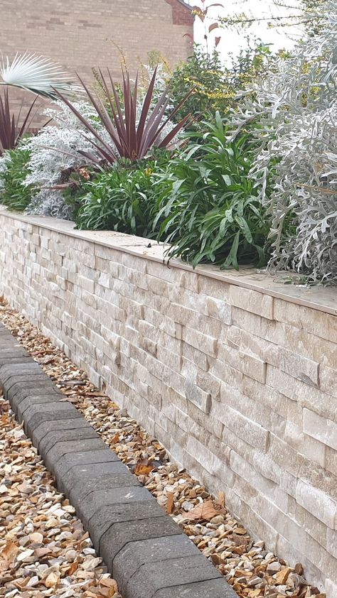 Your garden walls don't have to be boring you know. This picture shows cream textured split face wall tiles used to clad a garden wall. Mosaic Kitchen Tiles, Wildlife Garden Design, Face Mosaic, Stone Walls Garden, Mosaic Kitchen, Tiered Garden, Patio Wall, Tile Companies, Wall Garden