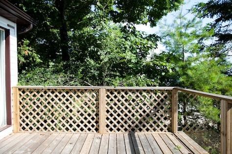 decks with lattice railing | Above: The couple replaced a diagonal lattice screen with a slatted ... Lattice Deck Railing, Lattice Railing, Lattice Deck Railing Ideas, Lattice Porch Railing, Wood Slat Railing Exterior, Trellis Deck Railing, Deck Railing Ideas Brick House, Lattice On Chain Link Fence, Deck Trellis