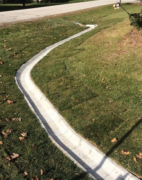 Ditch block prevents weeds and other obstructions that will block the water flow. Project installed by Dresen Landscape Contractors in Racine, WI. Ditch Ideas, Pretty Landscaping, Yard Drain, French Drain Installation, Diy Driveway, Landscape Drainage, Backyard Drainage, Drainage Ditch, Yard Drainage