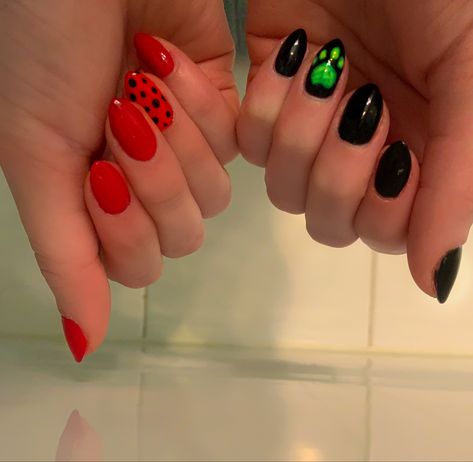 These are my Miraculous: Tales of Ladybug and Cat Noir nails. I painted one hand black and painted Cat Noir’s green paw on my ring finger and painted the other hand red and on that ring finger I did a ladybug printed of black dots. Cat Noir Nails Acrylic, Miraculous Nails Ideas, Ladybug And Cat Noir Nails, Mlb Nails, Cat Noir Nails, Miraculous Ladybug Nail Art, Miraculous Ladybug Nails, Ladybug Nail Art, Funny Nails