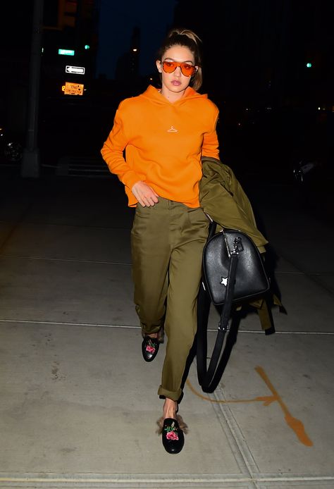 Orange Outfits, Poofy Sleeves, Curve Hugging Dress, Gigi Style, Gigi Hadid Style, Olive Pants, Olive Green Pants, Gucci Loafers, Orange Hoodie