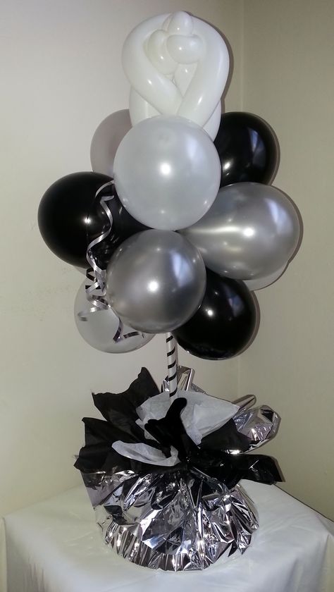 #Topiary Ideas: Silver, black and white topiary centerpiece embellished with a white rose topper. Black White And Silver Birthday Party, Black And Silver Table Centerpieces, Black And Silver Centerpieces Diy, Silver Centerpieces For Party, White Balloon Centerpieces, Black And White Centerpieces For Party, Black And Silver Centerpieces, White Vase Centerpiece, Onda Disco