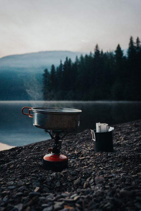 Boiling water on a MSR backpacking stove with a pour over coffee in a cup on a rocky beach in the mountains. Outdoorsy Aesthetic, Mountain Lifestyle, Coffee Shot, Earth Photos, Adventure Gifts, Nature Music, Mountain Photography, Coffee Photography, Adventure Photography