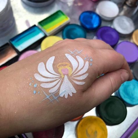 Angel Face Painting, Cross Face Paint, Christian Face Paint, Christmas Face Painting For Kids, Christmas Face Painting Easy, Angel Face Paint, Paintings Tattoo, Face Painting Images, Christmas Face Painting