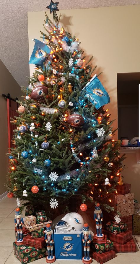 Miami dolphins tree! Made with traditional Christmas ornaments and fun football party decor Miami Dolphins Christmas, Miami Dolphins Christmas Tree, Miami Christmas, Nfl Christmas, Traditional Christmas Ornaments, Christmas Village Collections, Tree Inspiration, Dolphins Football, Sports Decor