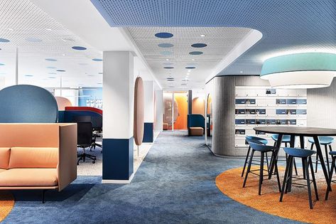 Neighborhoods, such as swimming pool, are defined by colors, some of which contrast, like the Muuto high-back sofa and orange carpet round, to help the sight-impaired easily demarcate spaces. The new space, spearheaded by Ippolito Fleitz Group, manages to neutralize disabilities while celebrating them at the same time—a place where differences are normal. #InteriorDesign #OfficeDesign #CoWorkingSpaces Colorful Office Space, Bonn Germany, Upholstered Walls, Lighting Concepts, Office Colors, Inclusive Design, Adjustable Height Table, Interior Architect, Design Research