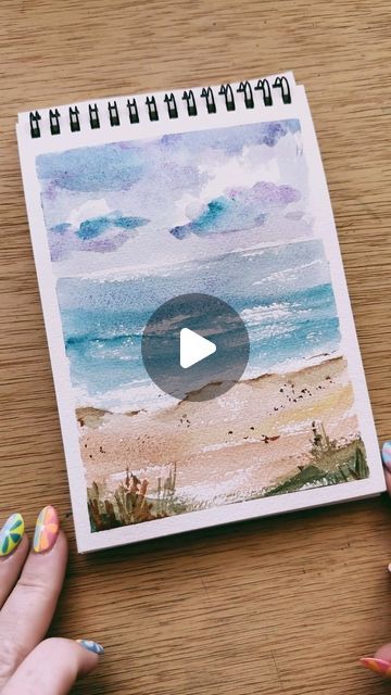 Kristin Van Leuven | Watercolor artist and instructor on Instagram: "Quick watercolor beach sketch to show you that your watercolor practice can be quick and messy with very little detail and still be beautiful!

I have been loving these watercolor paints #gifted to me by @winsorandnewton . The colors are so beautiful and immediately reminded me of the beach and so I had to do a quick sketch! 

The key with loose watercolor beaches is that lovely dry brush technique where you swipe the body of the brush flat against the paper. Then the texture of the paper will pop out and reveal areas that look like the perfect sparkle on the water, or rough texture in the sand. 

Try out this quick and fun beach technique and tag me! I would love to see and share 💕" Simple Beach Watercolor, Watercolor Seascapes Tutorial, How To Paint A Beach, Easy Watercolor Paintings Tutorials, Watercolor Beach Tutorial, Beach Watercolor Paintings, Watercolor Beach Scenes, Water Painting Ideas, Water Colors Painting