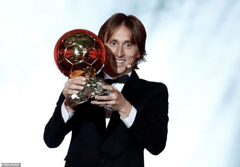 Modric pictured celebrating with the prestigious Ballon d'Or trophy after he was announced as the winner Modric Ballon Dor, Messi Y Cristiano, Real Madrid Win, Football Rings, France Football, Luka Modric, Le Ballon, Real Madrid Players, Messi And Ronaldo