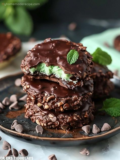 Indulge in the ultimate treat with our Fudgy Mint Chocolate No-Bake Cookies. These gems are a testament to the joy of mint and chocolate combined in a no-fuss recipe. Fudge Mint Chocolate No Bake Cookies, Mint Creme Biscuits, Fudgy Mint Chocolate No Bake Cookies, Chocolate Cookie With Andes Mint, Chocolate And Mint Desserts, Mint Cookies Christmas, Mint Treats, Mint Squares, Mint Chocolate Recipes