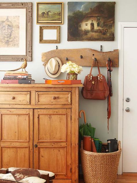 A rack of hooks for hats, bags, and a dog leash takes on the appearance of artwork when hung among a smattering of paintings and frames: http://www.bhg.com/home-improvement/storage/friendly-and-functional-entries/?socsrc=bhgpin042414almostlikeart&page=4 Small Entryways, Entry Tables, Small Entryway, Stylish Living Room, Entry Table, Style At Home, Better Homes And Gardens, Shoe Rack, The Wall