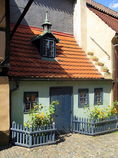 One of the picturesque, brightly painted "alchemist's" cottages at Golden Lane, Prague Castle. Tiny Doors, Prague Castle, Heart Of Europe, Shop Fronts, Prague Czech Republic, Small Houses, Cute House, Pretty House, Art References