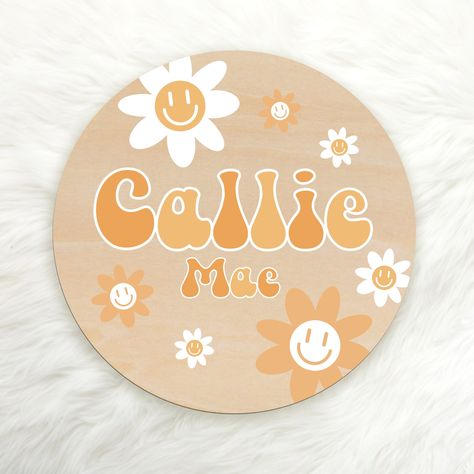 A sweet and adorable addition for your nursery, this personalized round wood sign will hold your child's name for generations. It's made from hardwood, with a happy daisy floral design in shades of yellow, personalized with your child's name. Perfect for baby birth announcements, pregnancy announcements or an adorable photo prop when babe makes their grand entrance into the world! PRODUCT INFO: Wood rounds are made of natural wood. 0.1 inch/0.25 cm in thick. Printed on wood using high-quality UV Painted Name Signs, Baby Birth Announcements, Cheerful Daisy, Groovy Daisy, Happy Daisy, Round Wood Sign, Pregnancy Announcements, Baby Birth Announcement, Unique Baby Names