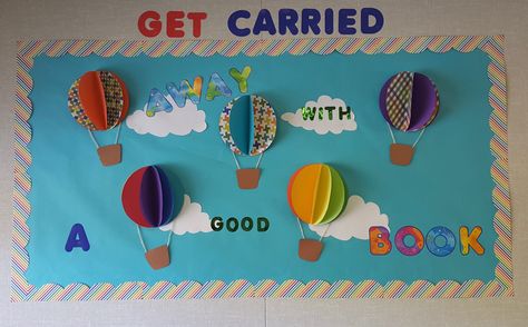 Hot air balloon bulletin board. "Get carried away with a good book" Ballon Bulletin Board Ideas, Hot Air Balloon Reading Corner, Hot Air Balloon School Theme, Hot Air Balloon Bulletin Board, Balloon Bulletin Board, Hot Air Balloon Classroom Theme, Library Bus, Preschool Travel, Junior Kindergarten