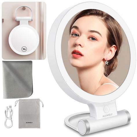 PRICES MAY VARY. 🌟𝐋𝐨𝐨𝐤 𝐘𝐨𝐮𝐫 𝐁𝐞𝐬𝐭 𝐀𝐧𝐲𝐰𝐡𝐞𝐫𝐞: With 3 different light settings, adjustable brightness, and a 350° foldable stand, this light up mirror is perfect for use in the bathroom, bedroom, dressing table, reading, live streaming or on the go . 💄𝐓𝐫𝐮𝐞 10𝐗 𝐌𝐚𝐠𝐧𝐢𝐟𝐢𝐜𝐚𝐭𝐢𝐨𝐧: This LED magnifying mirror features a 1x/10x double-sided magnification that makes it easy to see all the details you need when applying makeup, grooming, or styling your hair. 🎨𝐈𝐧𝐭𝐮𝐢𝐭𝐢𝐯𝐞 𝐓𝐨𝐮𝐜𝐡𝐬𝐜𝐫𝐞𝐞𝐧 𝐂𝐨𝐧𝐭𝐫𝐨𝐥𝐬: The intelligent touchscreen control system allows for easy brightness adjustment and has a memory function that lets you set your preferred lighting for each use. 🔋𝐋𝐨𝐧𝐠 𝐁𝐚𝐭𝐭𝐞𝐫𝐲 𝐋𝐢𝐟𝐞 𝐚𝐧𝐝 𝐅𝐚𝐬𝐭 𝐂𝐡𝐚𝐫𝐠𝐢𝐧𝐠: The rechargeable Lighted Magnifying Makeup Mirror, Magnifying Makeup Mirror, Table Reading, Lighted Makeup Mirror, Travel Makeup Mirror, Color Lighting, Bedroom Dressing, Beauty Mirror, Lighted Vanity Mirror