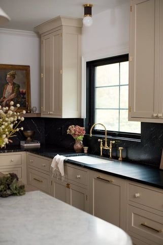 Connected Kitchen And Dining, Dark Counter Backsplash Ideas, Black Backsplash With Black Countertop, White Shaker Kitchen Cabinets Black Countertop, Black Countertops White Oak Cabinets, Beige Kitchen With Dark Countertops, Vintage Kitchen Black Countertop, Black Kitchen Countertops Beige Cabinets, Master Bath Long And Narrow