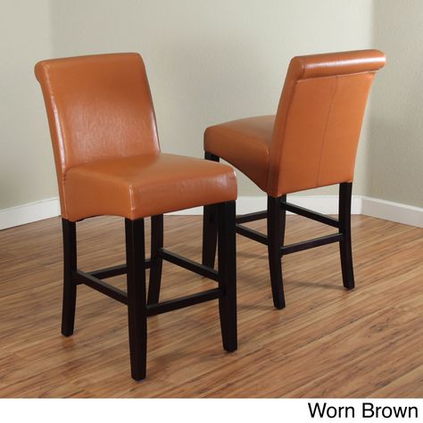 Constructed with durable wood with faux leather upholstery, this set of two counter stools is offered in a variety of colors and feature a dark walnut-finished base. The shape of the seats are designe Leather Counter Stools, Counter Chairs, Counter Height Stools, Elegant Dining, Furniture Outlet Stores, Chairs For Sale, Transitional Style, Counter Stool, Bar Furniture