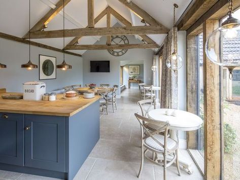 Simple shaker units and the polished limestone floor, looks great with old raw wood beams. #BarnKitchens #Barns Barn Conversion Kitchen, Barn Conversion Interiors, Limestone Floor, Open Plan Kitchen Dining Living, Barn Kitchen, Open Plan Kitchen Dining, Open Plan Kitchen Living Room, Barn Interior, Kitchen Dining Living