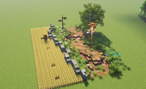 A dirt path following alongside a wheat field with a cobbled stone wall around it and a scarecrow inside. A signpost, lamp and tree decorate the other side of the path as well as smaller details including flower patches, hedgrows and stones. Minecraft Roof, Minecraft Kingdom, Minecraft Structures, Minecraft Blocks, Minecraft House Plans, Bangunan Minecraft, Minecraft Farm, Minecraft Cottage, Minecraft Medieval