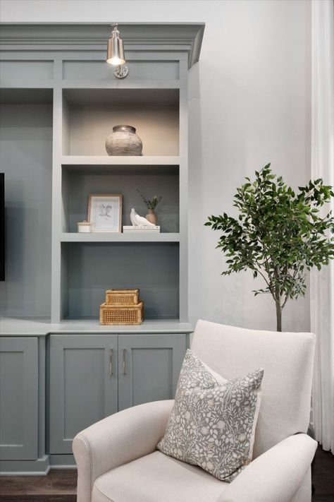 The coziest reading nook complete with blue custom built-ins for extra storage in this living room remodel. The finishing touch was the douple silver sconces for additional lighting. Built Ins With Lights, Bookshelves Lighting, Builtin Bookshelves, Bookshelf Lighting, Living Room Built Ins, Custom Built Ins, Room Remodel, Living Room Remodel, Cozy Reading Nook