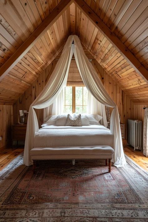 Discover 25 breathtaking vaulted ceiling bedroom ideas that will transform your sleeping space into an architectural masterpiece. Each design showcases unique ways to elevate your bedroom's aesthetic, blending style and spaciousness. From rustic wooden beams to modern lighting fixtures, these inspirations cater to diverse tastes, ensuring your bedroom becomes a serene and stylish sanctuary. Perfect for those looking to revamp their bedroom with a touch of elegance and grandeur. Vaulted Ceiling Bedroom Ideas, Attic Bedroom Ideas Aesthetic, Ceiling Bedroom Ideas, Vaulted Ceiling Bedroom, Canopy Over Bed, Attic Bedroom Storage, Inviting Bedroom, Attic Bedroom Designs, Storage Solutions Bedroom