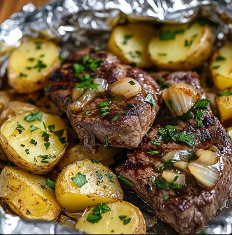 This Garlic Butter Steak and Potato Foil Packets recipe is an easy and delicious meal that’s perfect for grilling, baking, or even cooking over a camp... Check more at https://easyrecipeslife.com/garlic-butter-steak-2/ Garlic Steak Bites And Potatoes, Juicy Steak Bites, Steak Bites And Potatoes, Potato Foil Packets, Garlic Steak Bites, Carrot Cake Cheesecake Recipe, Foil Packet Potatoes, Garlic Butter Steak Bites, Butter Steak Bites