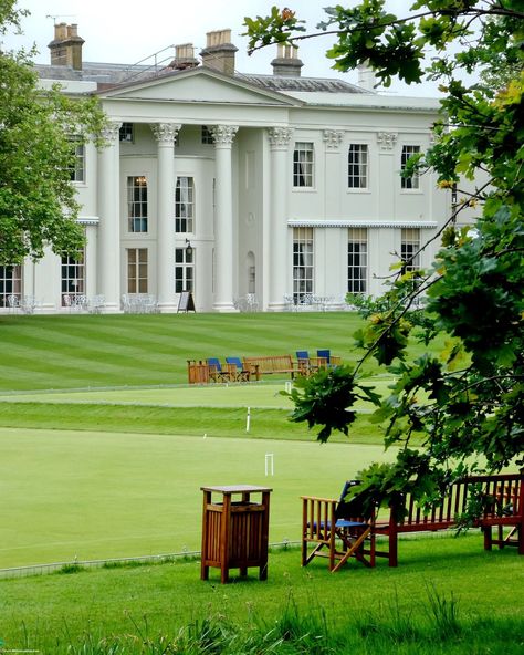 ⛳ 🎩 Obsessed with the façade of the Hurlingham Club House in London. It's such an elegant display of neoclassical architecture, characterized by symmetrical design and refined details. The building exudes an air of timeless sophistication, featuring a grand portico with tall, stately columns that support a classic pediment. The brickwork is complemented by large sash windows, each framed with decorative stone lintels and sills, allowing ample natural light to flood the interiors. An ico... Hurlingham Club, House In London, Neoclassical Architecture, Symmetrical Design, London Christmas, Sash Windows, Brickwork, Stone Decor, Neoclassical