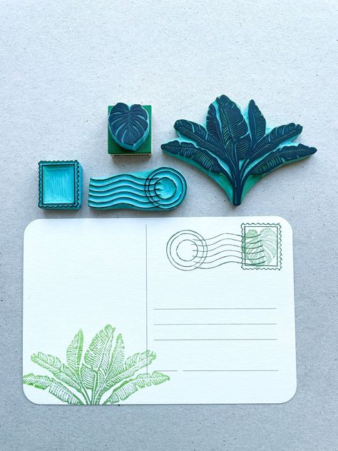 Set of 4 hand carved rubber stamps of postage stamping for summer traveling ideas. The set includes: - One postage stamp design size: about 1" tall (2.5cm) - One postage seal stamp size: 2.25" wide (5.5cm) - One Banana leaves  stamp size: 3.35" (9cm) - One mini Monstera leaf stamp size: almost 1" tall (2.5cm) They all come with wood base for easy stamping and inside a box for easy storage. (Inks are not included) - Uses: stamp on postcards, notebooks, bookscraping, traveling journal and more Tha Traveling Journal, Mini Monstera, Leaf Stamp, Homemade Stamps, Eraser Stamp, Postage Stamp Design, Hand Carved Rubber, Linoleum Print, Lino Art