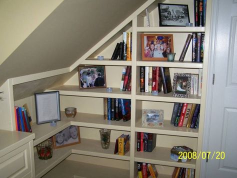 Bookshelves in a chalet-style home Bookcase Walls, Storage Bookcases, Bookshelves Wall, Angled Wall, Eaves Storage, Wall Bookshelf, Nails Tools, Slanted Walls, Rustic Bookcase