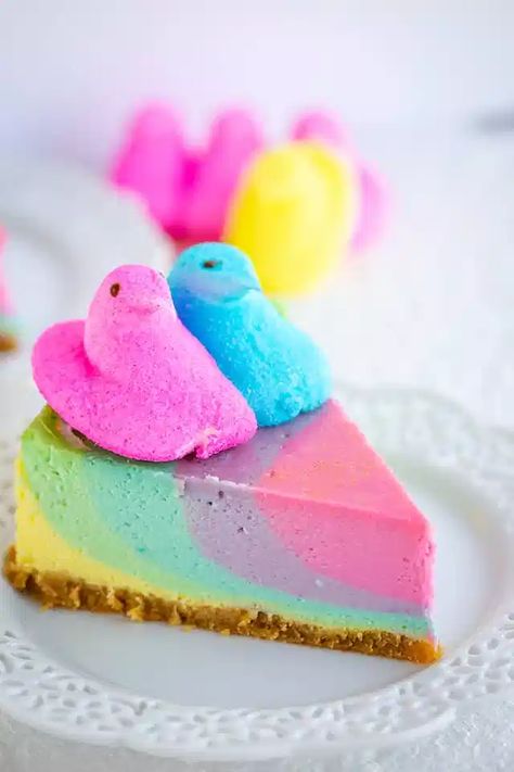 Peeps Marshmallow Cheesecake - This Peeps Marshmallow Cheesecake is a pastel rainbow cheesecake flavored with Peeps coffee creamer and marshmallow creme. It's makes the perfect Easter cheesecake or spring dessert! #cookiedoughandovenmitt #pastel #dessertfoodrecipes #dessertrecipes #cheesecakerecipes #easterdesserts #easter Peeps Marshmallow Treats, Easter Peep Cake Ideas, Peep Dessert Ideas, Peeps Dessert Ideas, Recipes With Peeps, Easter Peeps Ideas, Easter Cake Flavors, Peeps Dessert, Marshmallow Cheesecake