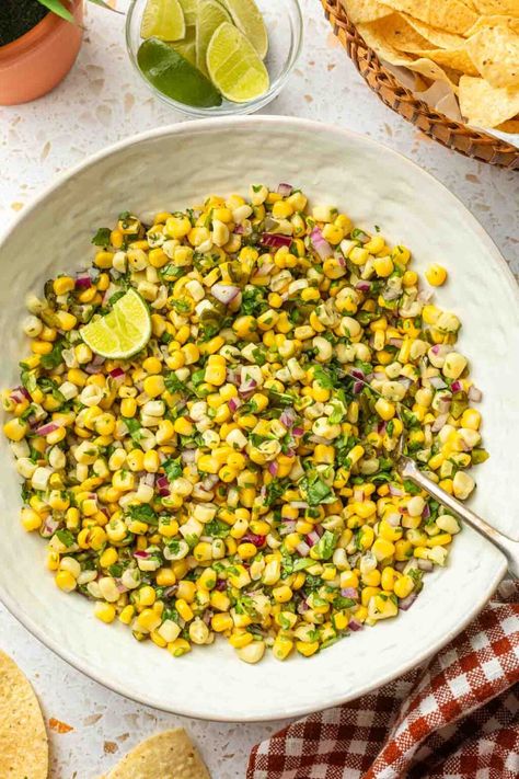 This roasted chili corn salsa is made with vibrant, golden kernels of sweet corn and bursting with bright flavors from diced red onions and fresh cilantro. The charred, roasted poblanos add plenty of flavor and a touch of heat that is balanced by a zesty lime dressing. This summer salsa recipe has an outstanding crunch, plus it's is as refreshing as it is beautiful. Roasted Corn Salsa Recipe, Roasted Chili Corn Salsa, Summer Salsa Recipes, Chili Corn Salsa, Asian Chicken Wraps, Roasted Corn Salsa, Summer Salsa, Corn Salsa Recipe, Peanut Chicken