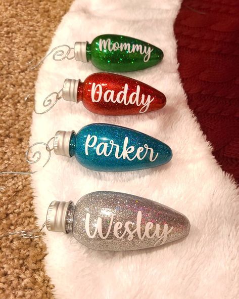 Personalized Christmas Ornaments! How cute are these?! Perfect for that special touch on the Christmas tree. Great idea for gifts! You get to pick your glitter color & font option. Names will  be in white unless specified differently 3.5 inch plastic ornaments, You don't have to worry about them breaking! All names will be either max 2 inches long or max 1 inch height, whichever comes first. The shorter the name the bigger it'll appear. The longer the name the smaller it'll appear. If you have a Homemade Personalized Christmas Gifts, Personalized Name Ornaments, Homemade Christmas Gifts With Cricut, Christmas Circut Idea, Advent Ornaments Diy, Light Bulb Ornaments Christmas, Christmas Circuit Projects, Lightbulb Ornaments Christmas Diy, Vinyl Diy Projects