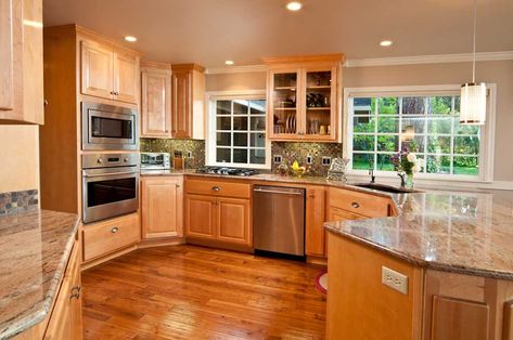 Modern, spacious kitchen with hardwood floors and cabinets Cabinet Trends, Honey Oak Cabinets, Kitchen Cabinet Trends, Light Wood Cabinets, Rta Kitchen Cabinets, Wood Floor Kitchen, Kitchen Sink Design, Oak Kitchen Cabinets, Kitchen Wood