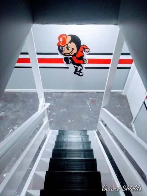 This is a wall from a basement I painted with an Ohio State Buckeye theme. This is the brutus I painted beside a stripe that goes across the whole basement Ohio State Buckeyes Room Ideas Man Cave, Ohio State Buckeyes Man Cave, Ohio State Basement Ideas, Ohio State Basement, Ohio State Buckeyes Room, Ohio State Rooms, Man Cave Basement Diy, Ohio State Colors, Man Cave Bathroom