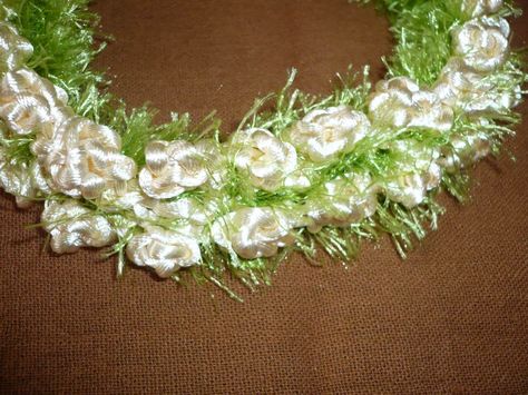 To make a pikake flower lei out of rattail, start with a roll of 2 mm rattail. A 200 yard spool will make about 5 lei. Real pikake flowers  are off white. You can make lei in any color you want. Mo… Crochet Lei, Hawaii Crochet, Crochet Hawaiian, How To Make Leis, Eyelash Yarn Crochet, Diy Leis, Yarn Lei, Pikake Lei, Pikake Flower