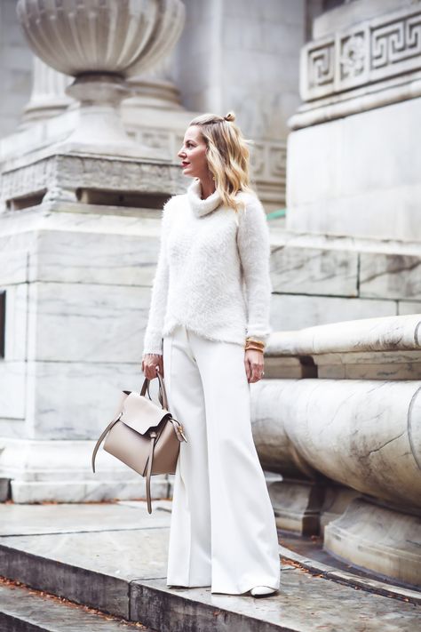 Erin Busbee of Busbee Style wearing an all white look with wide leg white pants and white sweater White Pants In Winter, Erin Busbee, All White Party Outfits, Heels Ideas, Winter White Outfit, Busbee Style, White Wide Leg Trousers, White Party Outfit, White Pants Outfit