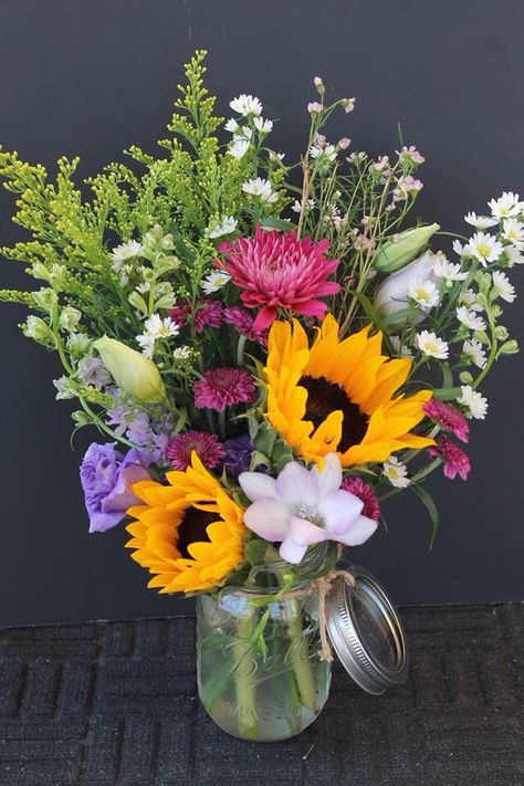 Wildflowers in a mason jar Sunflower And Wildflower Bouquet Vase, Wildflower Summer Bouquet, Wildflower Flower Arrangements, Zinnia Bouquet Mason Jars, Mason Jar Arrangements Floral, Mason Jar Flower Arrangements Simple, September Flower Arrangements, Paradox Museum, Mason Jar Bouquets