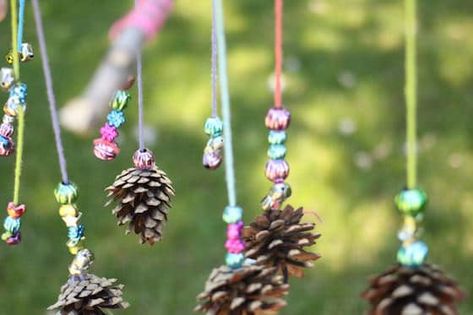 mobile-craft-with-sticks-pinecones-yarn-and-beads Pinecone Crafts Kids, Kid Summer, Mobiles For Kids, Mobile Craft, Pinecone Crafts, Christmas Decorations Centerpiece, Painted Pinecones, Penguin Crafts, Sharpie Crafts