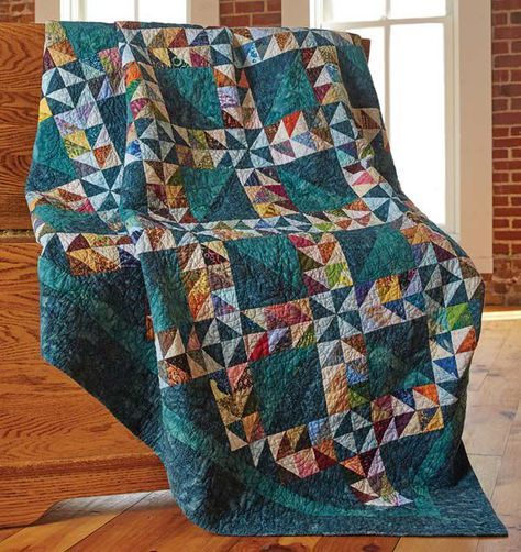 Lady of the Lake Quilt - Fons & Porter | Quilting Daily Lady Of The Lake Quilt, Lake Quilt, Quilt Pattern Download, Lady Of The Lake, Triangle Quilts, Half Square Triangle Quilts, Batik Quilts, Triangle Square, Make A Quilt