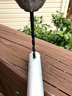 drilling hole in EMT pipe to make DIY bird feeder pole Diy Bird Feeder Pole, House On Poles, Birdhouse Pole, Bird Feeder Stands, Bird Feeder Poles, Squirrel Proof Bird Feeders, Easy Bird, Metal Deck, Metal Railings