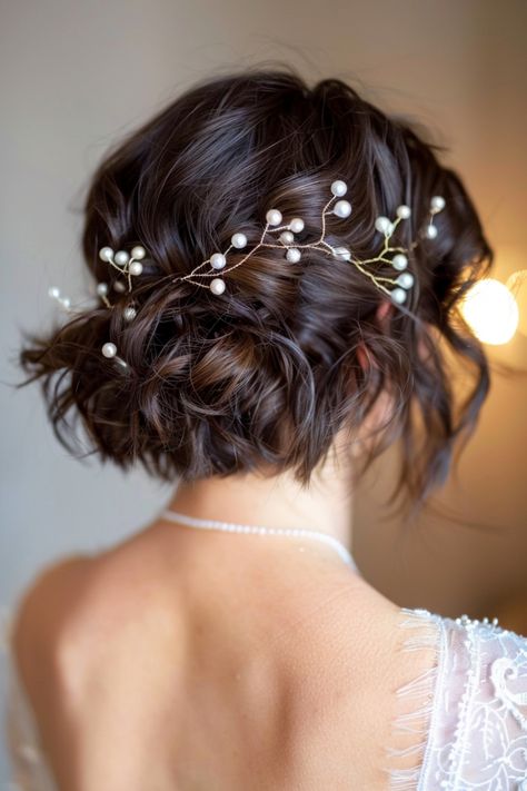 Wedding hairstyles for short hair can be both chic and striking, bringing a unique charm to your look. Discover the best short hairstyles for brides here. Bob Style Wedding Hair, Bridesmaid Hairdo For Short Hair, Short Brunette Wedding Hair, Wedding Short Curly Hairstyles, Wedding Hairstyles For Pixie Hair, Short Curly Bridal Hairstyles, Short Wedding Hair With Bangs, Wedding Short Hairstyle Women, Short Wavy Wedding Hair