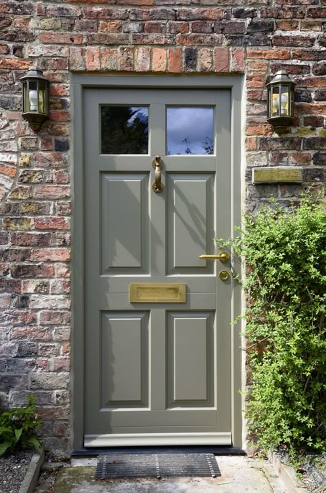 A beautiful Chalfont entrance door in Oxford Clay, with Polished Brass Unlacquered ironmongery from Samuel Heath. Manufactured in engineered Meranti Hardwood. Painted Entrance Door, British Front Doors, Wooden French Doors Entrance, Cottage Front Door Colors, Front Door Grey, Country House Front Door, Front Door Ironmongery, Entrance Door Color, Fully Glazed Front Door