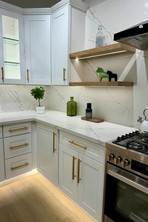 Quartz Countertops Veined Countertops, White Kitchen With Gold Hardware, Gold Kitchen Hardware, Calcutta Gold, Luxury Kitchen Cabinets, Kitchen And Bath Showroom, Bath Showroom, White Quartz Counter, Bath Cabinet