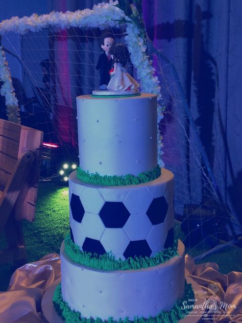 3-Tier Soccer Themed Wedding Cake This intricately designed 3-Tier Soccer Themed is a chocolate cake filled and covered with premium chocolate ganache and covered with flavored Fondant. Buttercream was also used in this cake for grass effect, accent. And on top of the cake is a beautifully handmade wedding cake topper, soccer themed as well. Venue: C3 Events Place, Greenhills, San Juan, Philippines #cakes #customcakes #soccerthemedweddingcakes #weddingcakes #customweddingcakes #customcakesph Soccer Themed Wedding, Soccer Wedding Cake, Soccer Wedding Ideas, Flavored Fondant, Marines Wedding, Soccer Themed Cake, Football Wedding Cake, Soccer Wedding, Football Wedding Theme