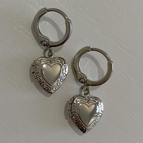 #locket #locketearrings #handmade #cottagecore #dainty #whimsical #dainty #earrings #fairycore #fairy #huggies #huggie #huggieearrings #silverearrings Heart Locket Earrings, Silver Handmade Earrings, Dangle Heart Earrings, Heart Charm Metal Earrings For Gift, Metal Dangle Heart Earrings With Heart Charm, Heart-shaped Surgical Steel Jewelry For Gifts, Silver Vintage Earrings, Silver Stainless Steel Hoop Earrings As Gift, Nickel-free Metal Heart Earrings As Gift