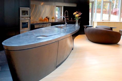 Trendy oval kitchen island with concrete countertop - Decoist Concrete Kitchen Island Ideas, Oval Kitchen Island, Countertops Stone, Concrete Kitchen Island, Kitchen Refacing, Island Countertop, Concrete Countertop, Stone Soup, Concrete Countertops Kitchen