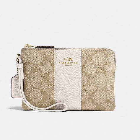 Coach Corner Zip Wristlet In Signature Canvas Color: Gold/Light Khaki Chalk Brand New! In Original Packaging Best Seller Signature Coated Canvas And Crossgrain Leather Two Credit Card Slots Zip-Top Closure, Fabric Lining Wrist Strap Attached 6 1/4" (L) X 4" (H) 1/2" (W) Pretty Tote Bags, School Bag Essentials, Luxury Bags Collection, Handbag Essentials, Cute Wallets, Girly Bags, Fancy Bags, Pretty Bags, Coach Wristlet